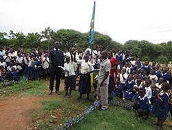 Archy Gomba distributes school supplies